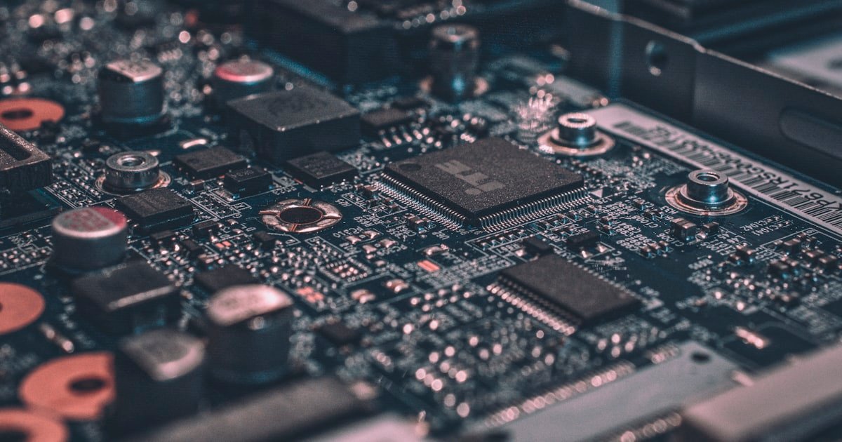Dark circuit board close-up representing the technology behind no-code workflow automation